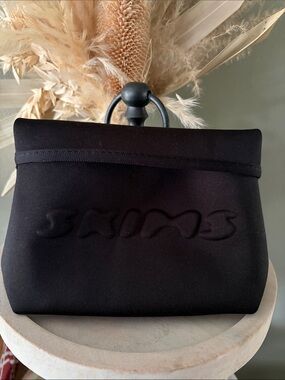 Skims neoprene sculpted bag